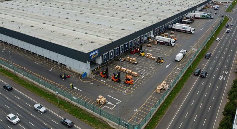 images/solution-brief/us/aerial-zoomedout-shot-of-a-large-distribution-ware__73314.jpg#joomlaImage://local-images/solution-brief/us/aerial-zoomedout-shot-of-a-large-distribution-ware__73314.jpg?width=800&height=436